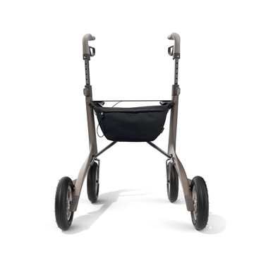 The Pocket Bag for ByAcre Carbon Fiber Rollators, shown from the front against a white background, is a black accessory designed for four-wheeled mobility walkers with large tires and adjustable handles.