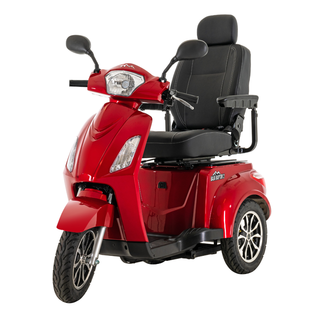 The Pride Baja® Raptor® 2 Bariatric 3-Wheel Scooter is a red mobility scooter with LED lights, padded seat, armrests, headrest, and handlebars—designed for accessible and comfortable personal outdoor transportation.