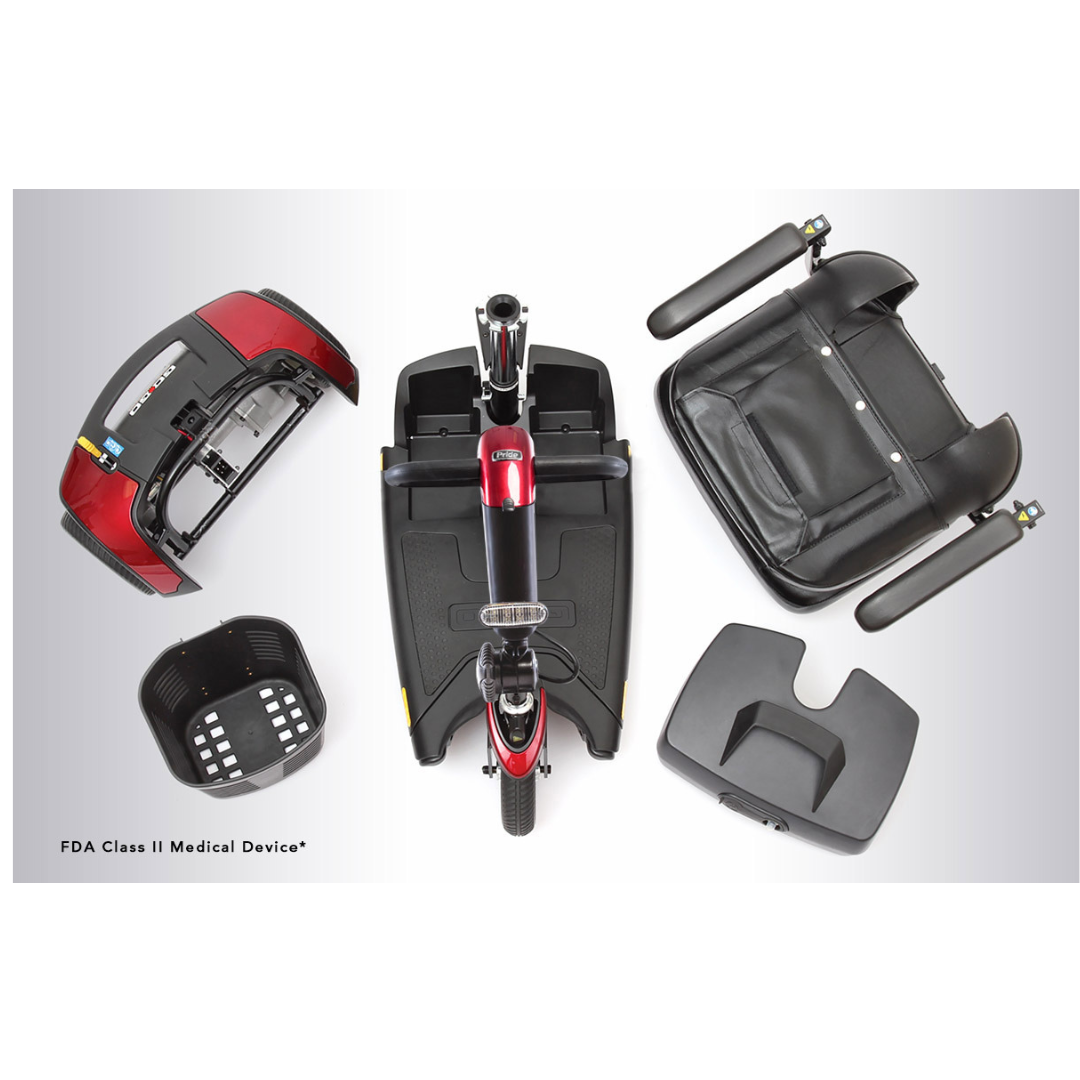A top view of the disassembled Pride Go Go® Sport 3-Wheel Scooter highlights its red and black main body, seat, battery pack, and basket on a gray background. The FDA Class II Medical Device label is visible at the bottom left. Its customizable design ensures personalized comfort.
