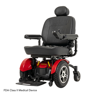The Pride Mobility Jazzy® Elite 14 Powerchair is a red and black power chair with padded seat, armrests, headrest, large rear wheels, and an armrest joystick control. Text reads FDA Class II Medical Device.