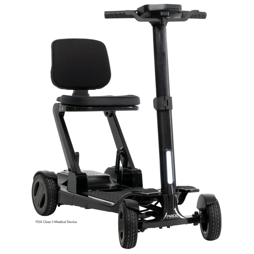 The Pride Mobility GoGo Carbon Ultralite Scooter is a compact, 35 lb black mobility device with a carbon fiber frame. It features four wheels, handlebars, and a padded backrest and seat. Its sleek design includes a narrow frame and textured footrest for easy portability.