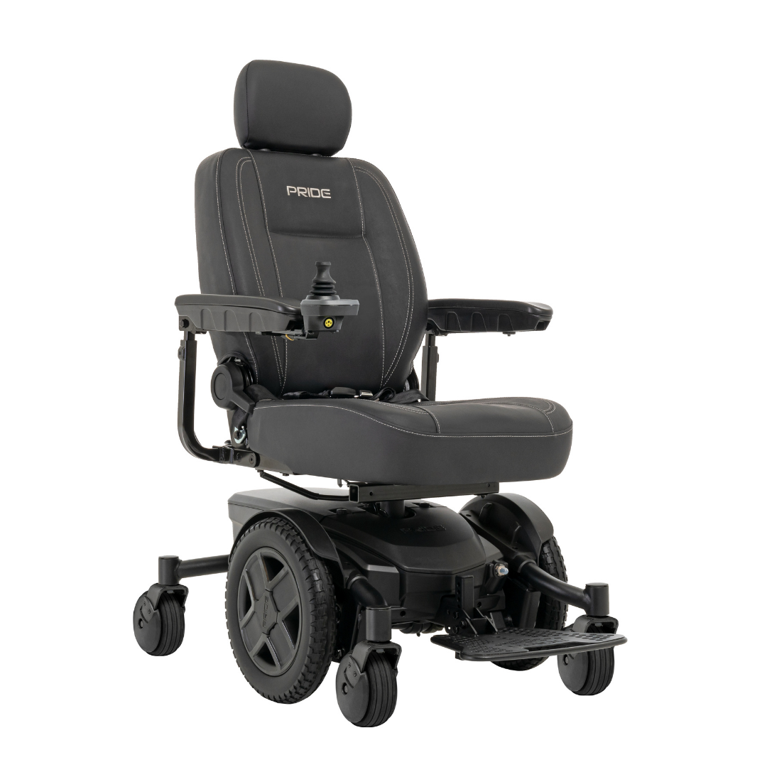 A black Pride Mobility Jazzy® EVO 613 Powerchair with padded seat, armrests, headrest, footrest, right-arm joystick control, and ATX Suspension for stability. The “Pride” brand is visible on the headrest.