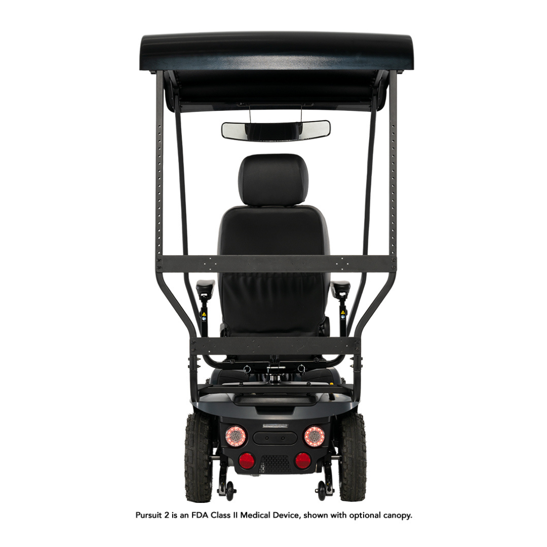 Rear view of a black Pride Mobility Pursuit® 2 Offroad HD Scooter with optional canopy, headrest, backrest, rearview mirror, and visible lights. Text at the bottom notes it is a Class II Medical Device.