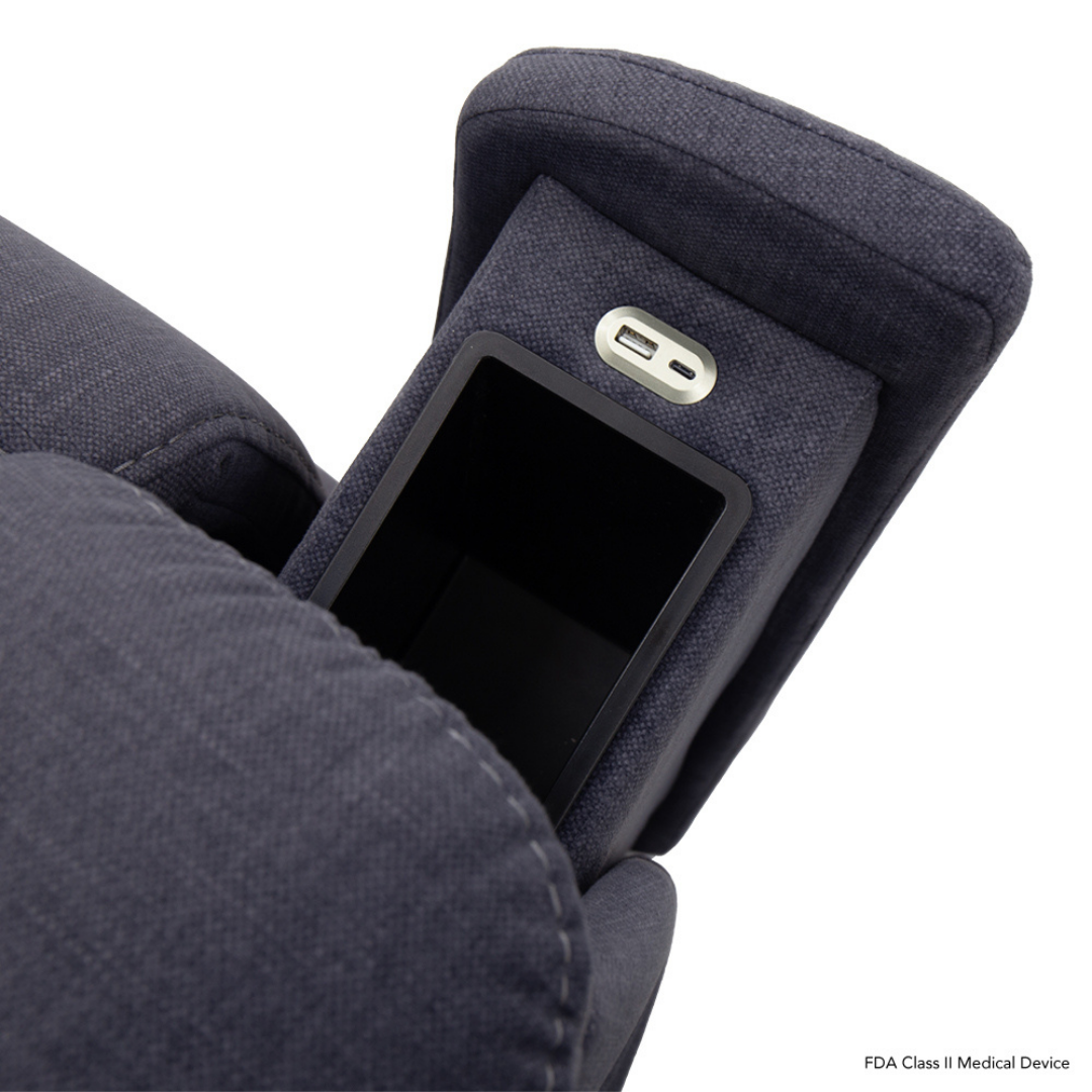 Close-up of a Pride Mobility Evolution Collection Power Lift Recliner armrest in dark fabric, showing premium features like a built-in storage compartment and USB charging port above the compartment.