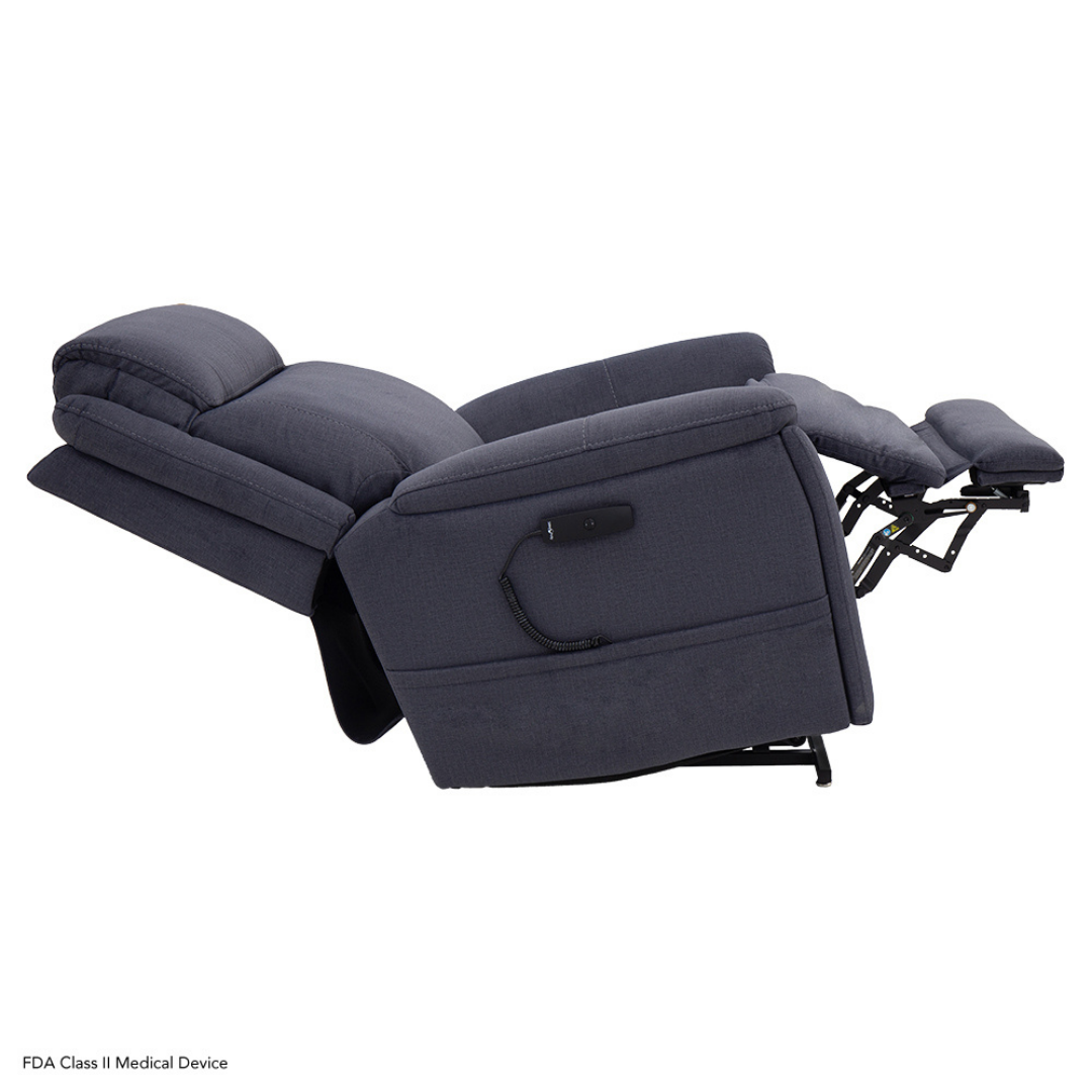 The Pride Mobility Evolution Collection Power Lift Recliners, upholstered in plush dark gray fabric, fully extend with a tilted backrest and raised footrest for comfort, support, and premium relaxation-enhancing features.