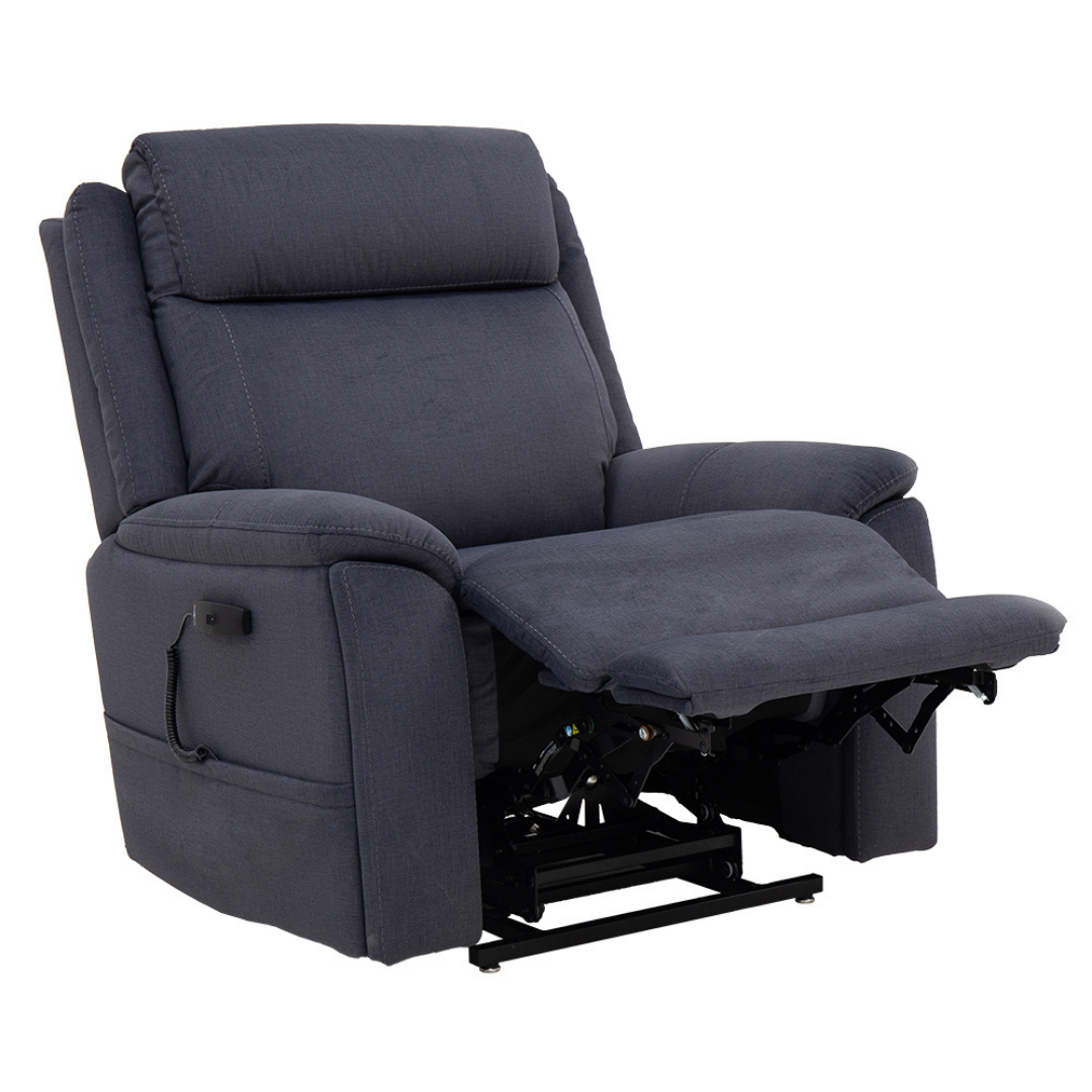 The Pride Mobility Evolution Collection Power Lift Recliner, shown in dark gray upholstery, features premium padding, armrests, an extended footrest, and is pictured partially reclined.