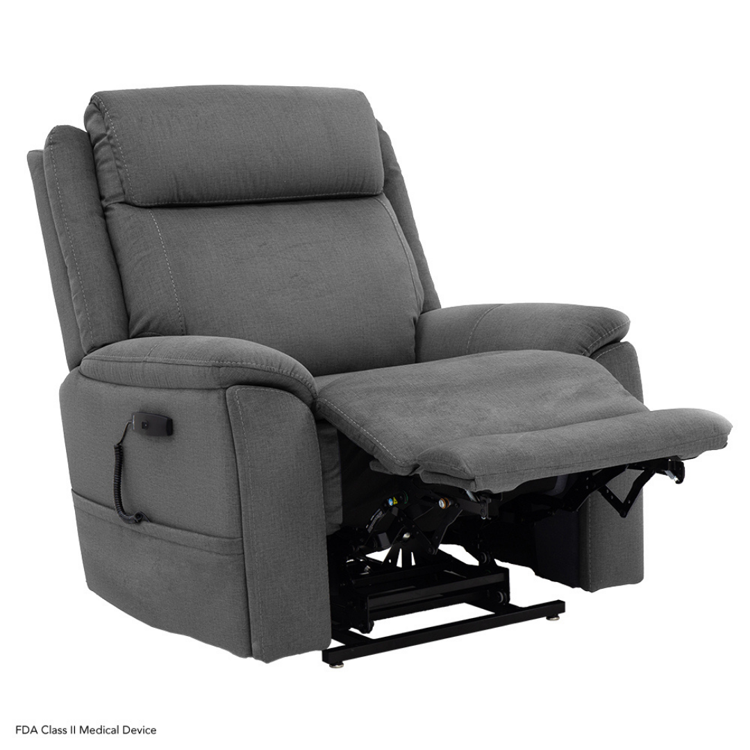 The Pride Mobility Evolution Collection Power Lift Recliner features gray upholstery, premium comfort, an extended footrest, and a side control panel for enhanced support.