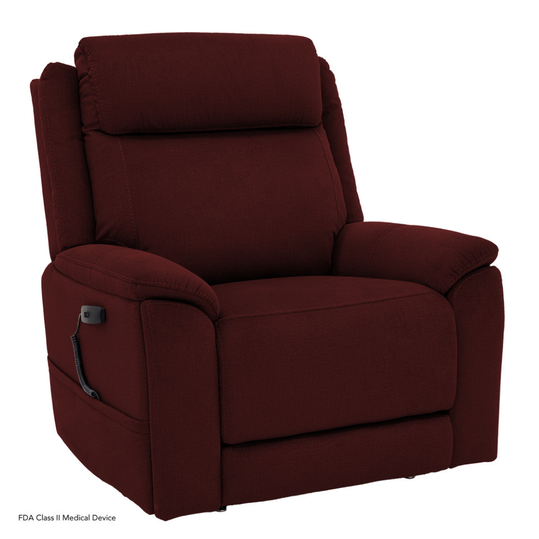 The Pride Mobility Evolution Collection Power Lift Recliner in plush burgundy features padded armrests, backrest, and a side-attached remote control for premium power functions. Displayed against a plain white background.