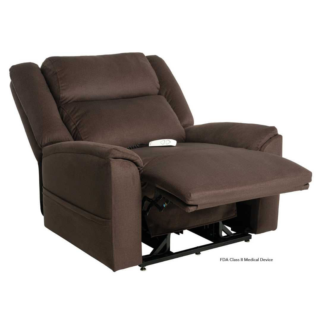 A large, brown fabric Pride Mobility Evolution Collection Power Lift Recliner with wide padded arms and extended footrest features a white remote control on the seat, showcasing its adjustable, premium options for relaxation or medical use.