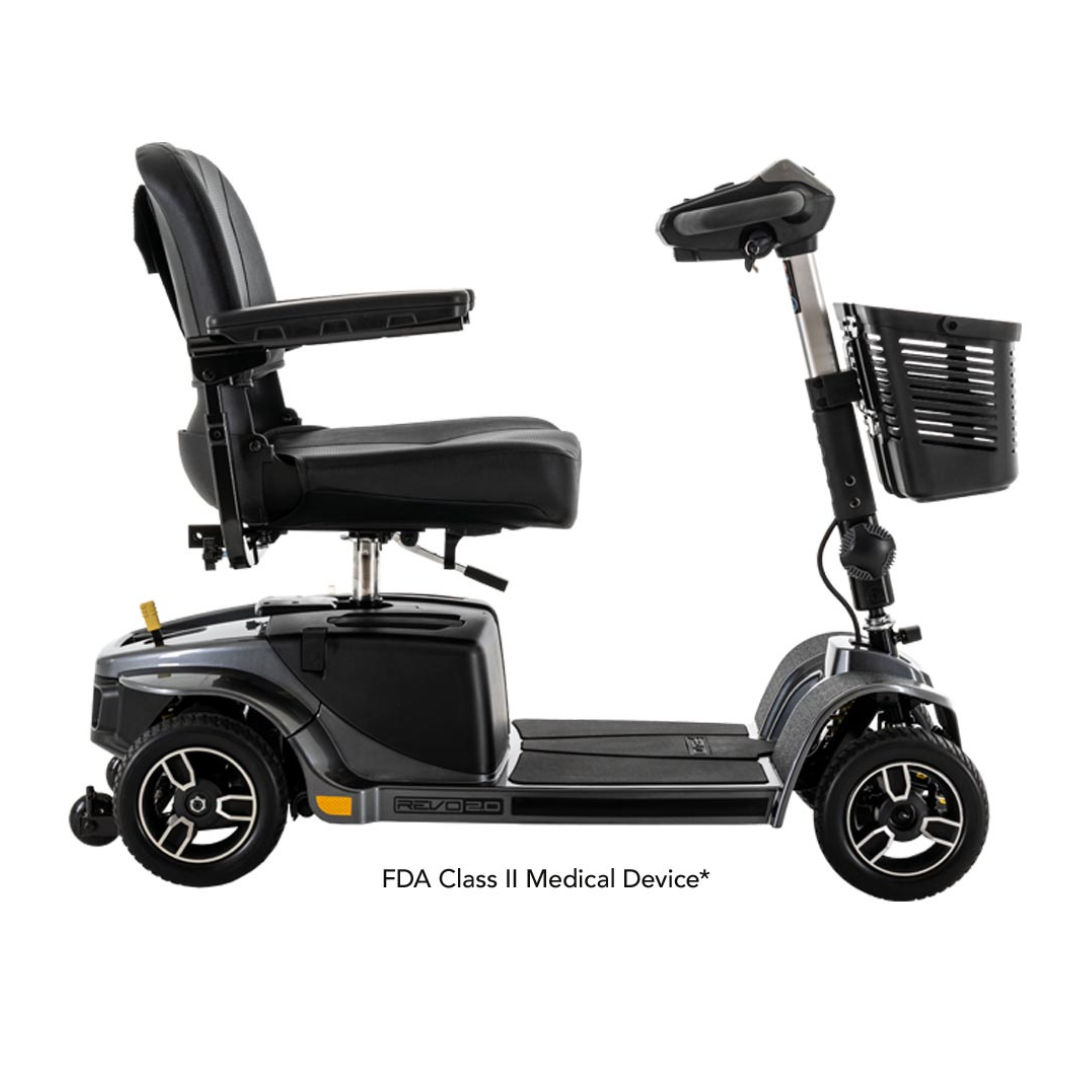 The Pride Mobility Revo® 2.0 4-Wheel Scooter is a durable black scooter with four large wheels, a padded seat, armrests, and a front basket. Text below reads FDA Class II Medical Device*.