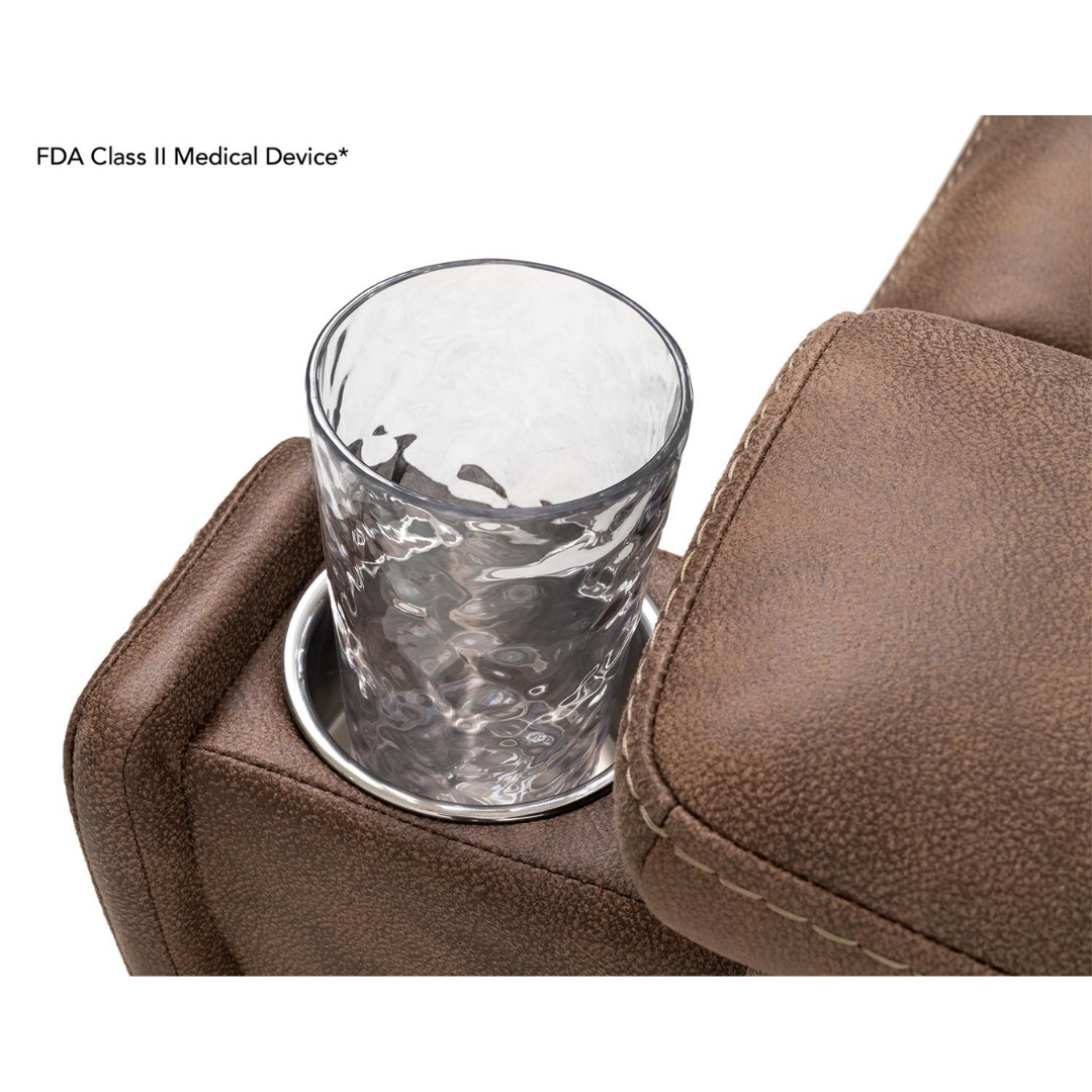 A close-up shows a clear glass of water in a cup holder on the armrest of the brown, textured Pride Mobility VivaLift! Radiance Recliner with Lift Assist & Heat, which offers infinite positioning for ultimate comfort.