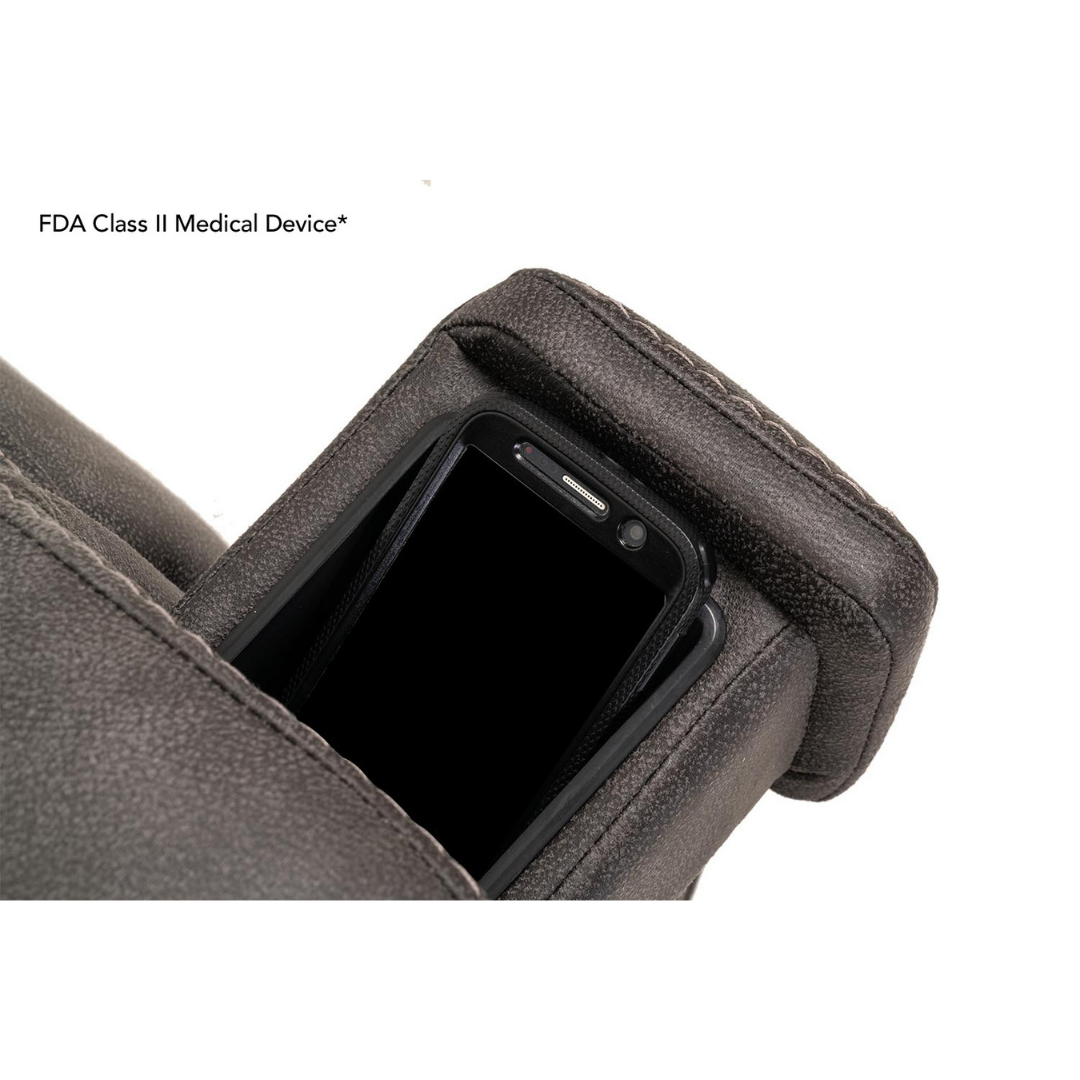 A black smartphone sits in a pocket on the armrest of the dark gray Pride Mobility VivaLift! Radiance Recliner with Lift Assist & Heat. The text FDA Class II Medical Device* appears in the top left corner.