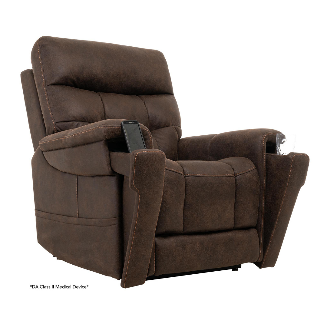 The Pride Mobility VivaLift! Radiance Recliner with Lift Assist & Heat is a brown leather power chair with padded armrests, infinite positioning, and a remote in the right armrest pocket, displayed against a white background.