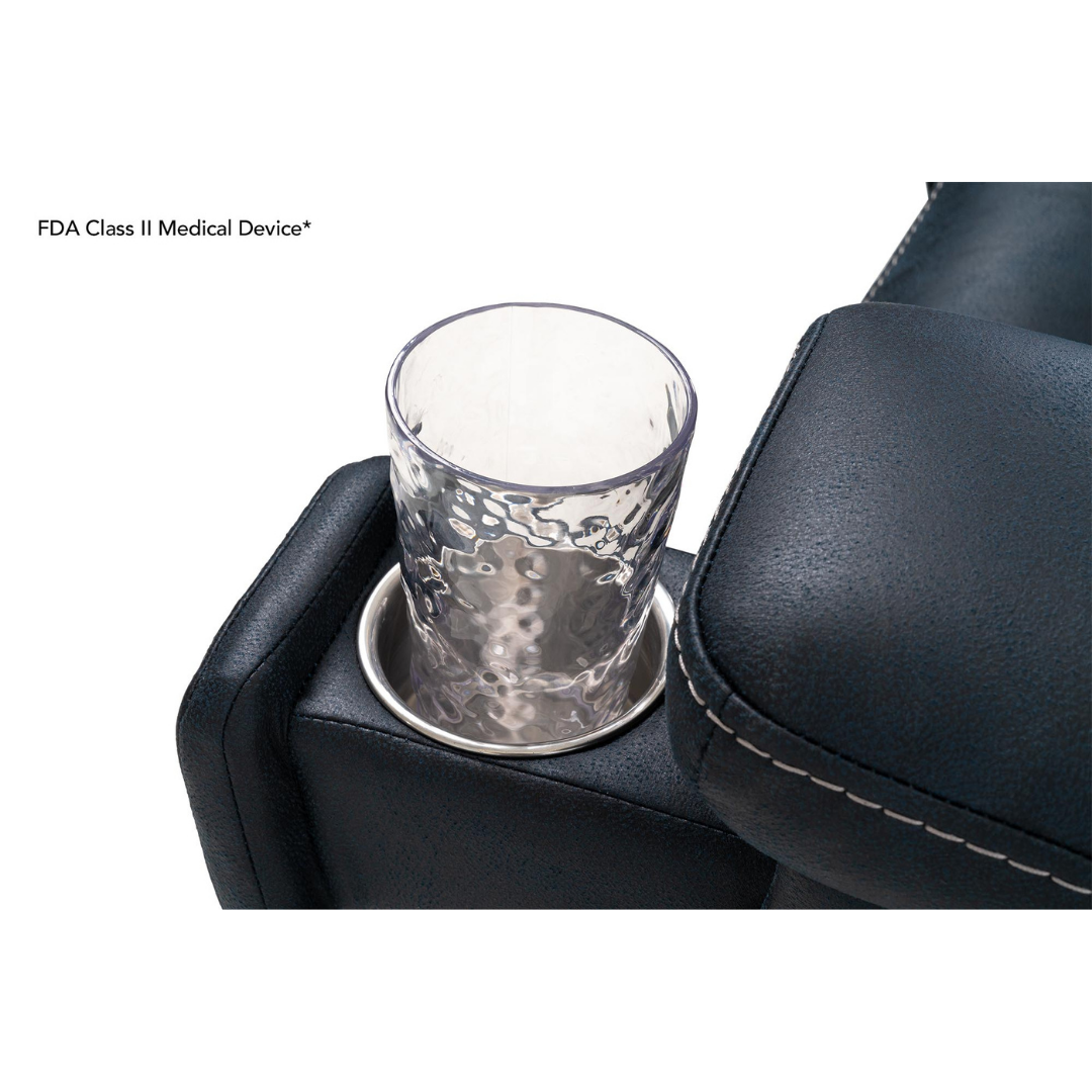 A clear textured glass sits in a built-in cup holder on the dark, cushioned armrest of the Pride Mobility VivaLift! Radiance Recliner with Lift Assist & Heat. Text in the corner reads FDA Class II Medical Device*.