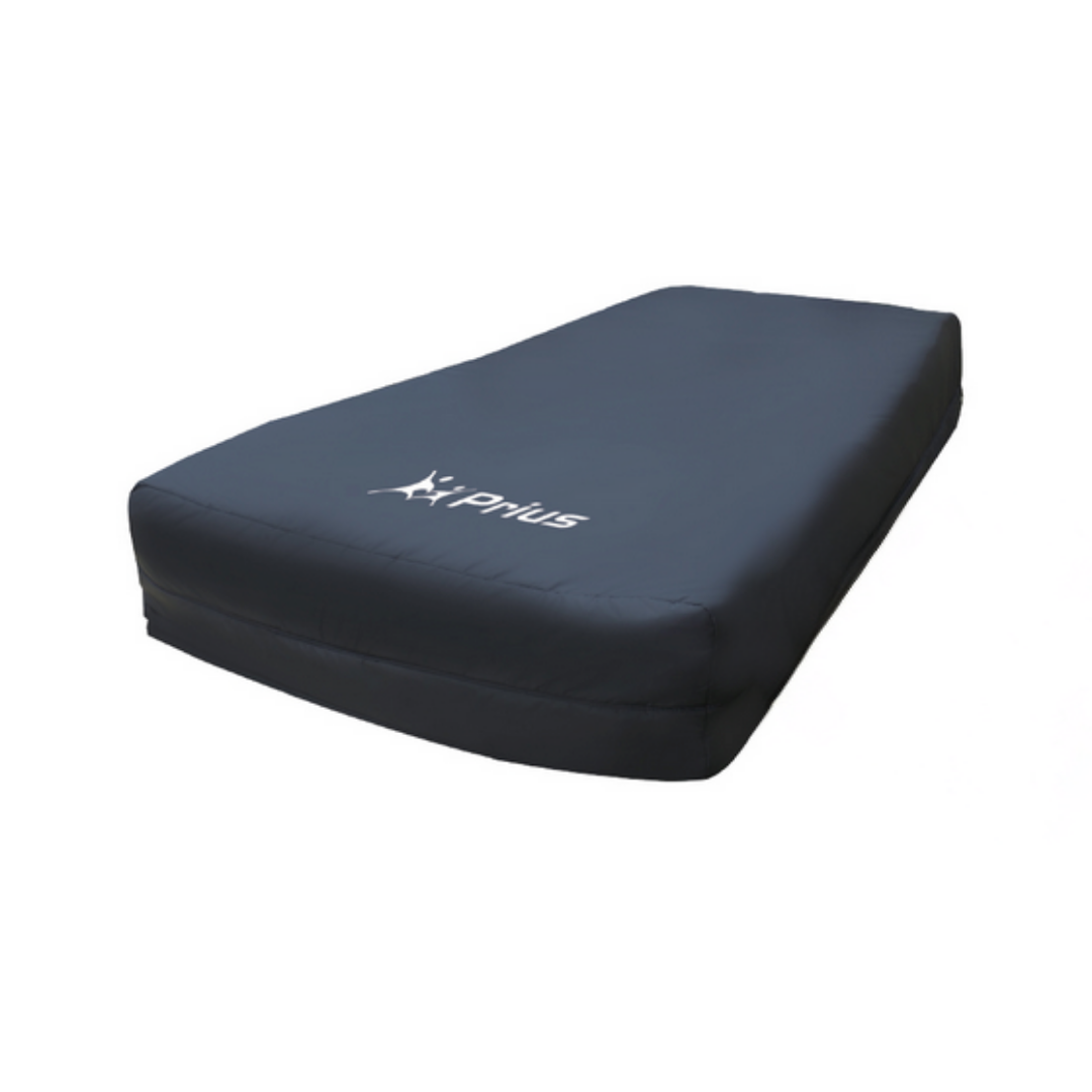 A black Prius Rhythm Multi Mattress System (1,000 lb capacity) with rounded corners and fitted cover displays the white XPRius logo on top. Designed for Low Air Loss comfort, it is shown against a plain white background.