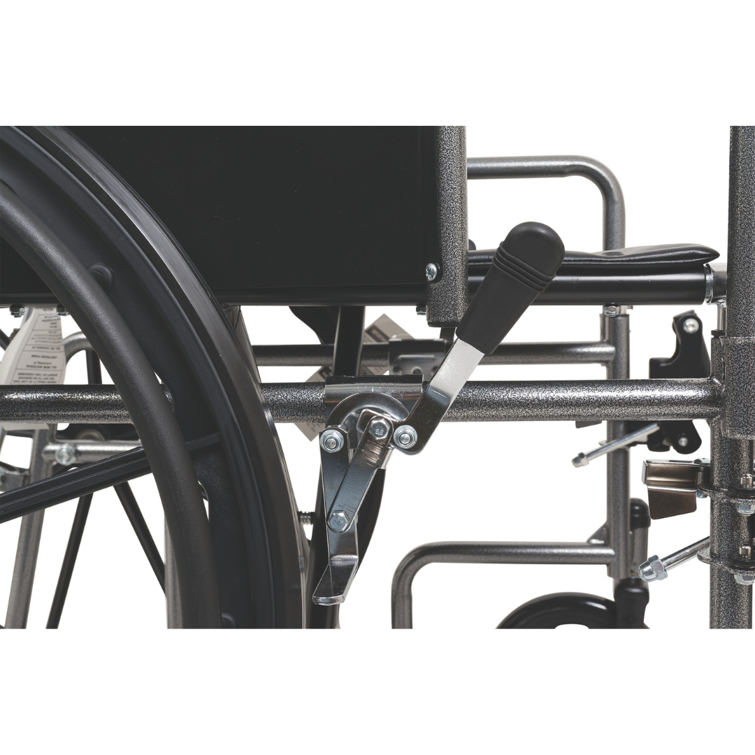 Close-up of the ProBasics Reclining Wheelchair with Removable Desk Arms, showing the brake lever, wheel assembly, durable steel frame, black seat, and visible rear wheel and armrest details.