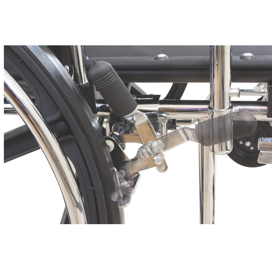 Close-up of the ProBasics K7 Heavy Duty Bariatric Wheelchairs wheel and metal brake lever, showing the locking mechanism engaged against the tire. The chair’s sturdy frame and wide seat are also partially visible.