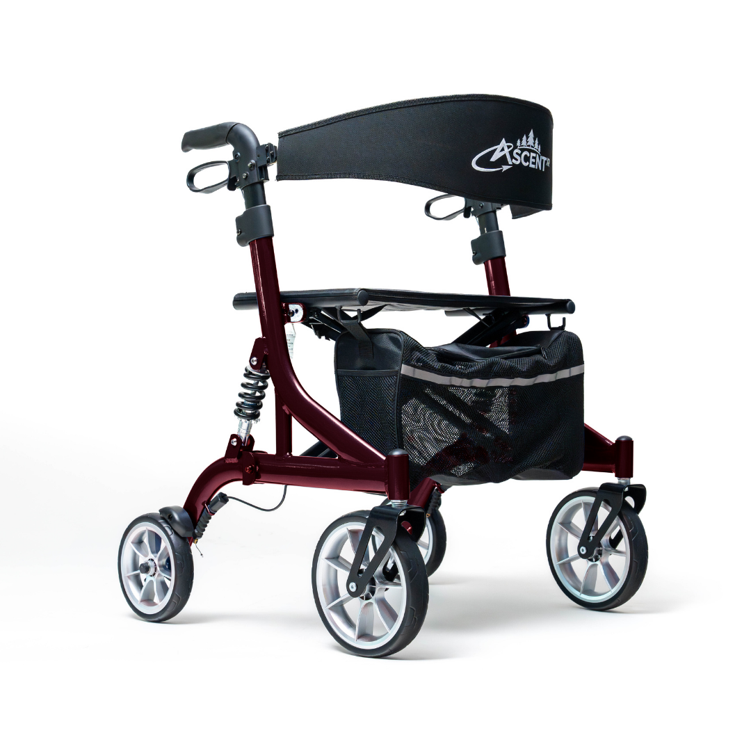 The Probasics Ascent XR™ Euro-Style Bariatric Rollator with Suspension in red features four large wheels, ergonomic handlebars, a Crescent-backrest, and a mesh storage basket beneath the seat.