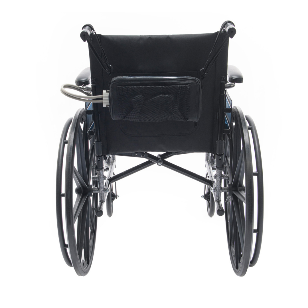 A black manual wheelchair shown from the back with large rear wheels, armrests, a backrest pouch, and the Protekt® Seat Relief - Alternating Pressure Seat Cushion System by Proactive for comfort and pressure injury prevention.