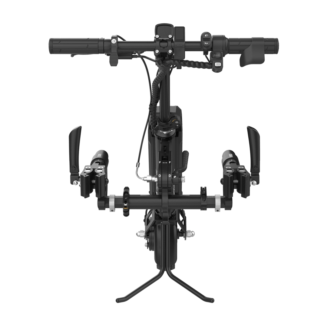 Top-down view of the Rehasense ECO Travel BX Power Add-On – Lightweight Wheelchair Assist mounted on a manual wheelchair, spotlighting its drop handlebars, gear shifters, brake levers, and central stand near the front wheel.