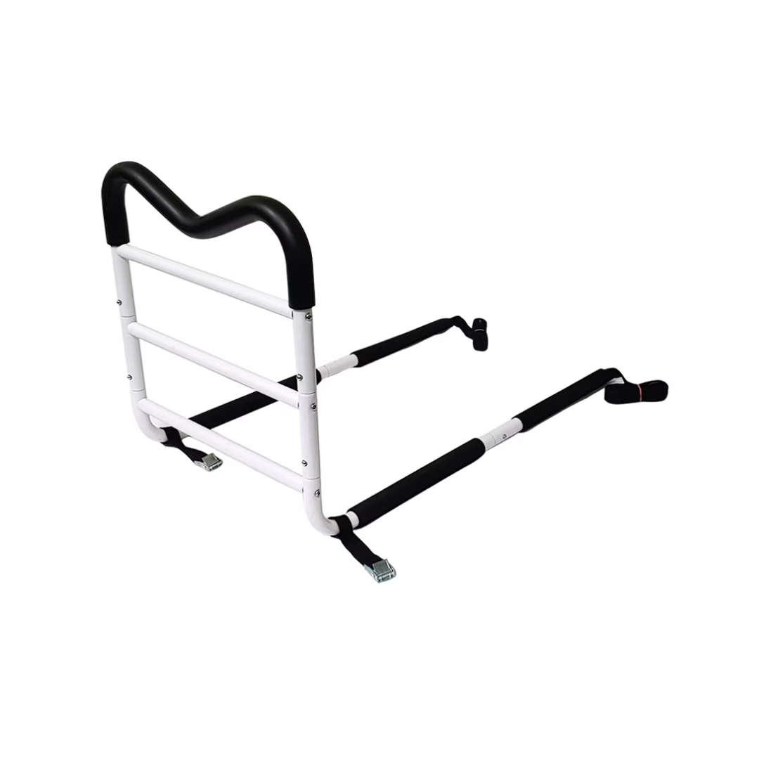 The Rhythm Deluxe Bedside Assist Wave Handle Without Leg is a white and black adjustable bed safety rail with a padded handle, two horizontal support bars, and secure straps for mattress attachment to aid safe bed entry and exit.