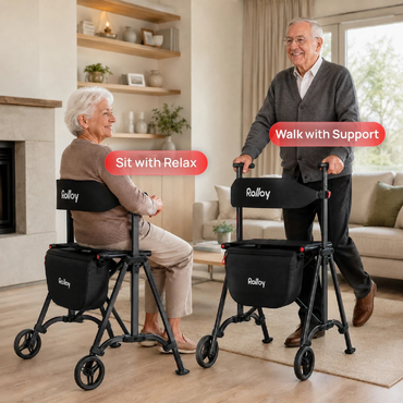 An elderly woman relaxes on a Rolloy Compact Master Bariatric 2-Wheel Walker with Seat, while an elderly man stands using another walker for support in a cozy living room. Labels read "Sit with Relax" and "Walk with Support.