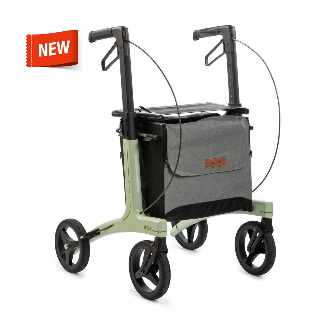 Light green and black Rollz Air Lightweight Folding Carbon Rollator (10.4 lbs) with large wheels, gray storage bag, and an orange NEW label in the top left corner.