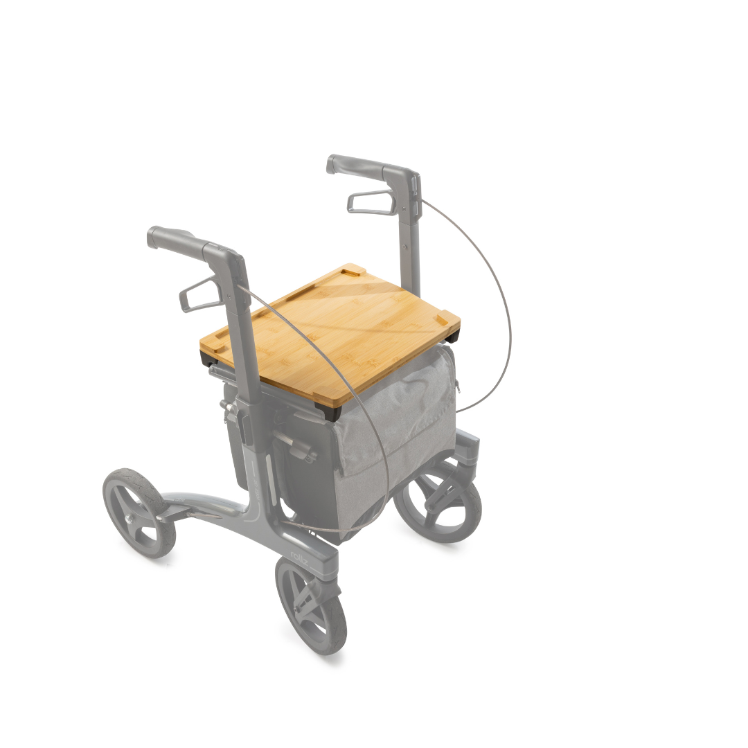 A Rollz Air Rollator is shown on a white background with the Bamboo Tray For the Rollz Air Rollator on top and a fabric bag attached below, highlighting the tray and bag features.