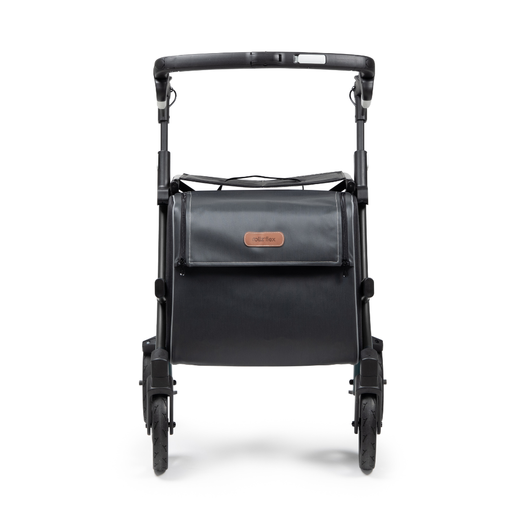 The black Rollz FLEX 2 Lightweight Rollator Walker features a handle, four wheels, and folds upright. Its sleek design includes a brown label on the front, offering stylish portability with an XL storage bag and seat.
