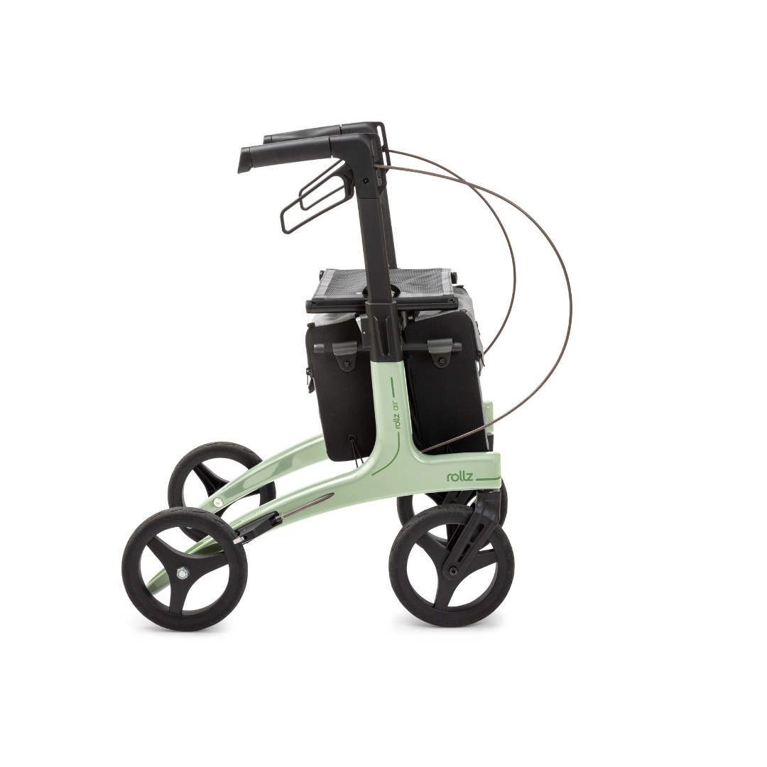 The Rollz Air Lightweight Folding Carbon Rollator weighs just 10.4 lbs and features a modern light green frame, four black wheels, black seat, black storage bags, and visible brake cables looped above the wheels.