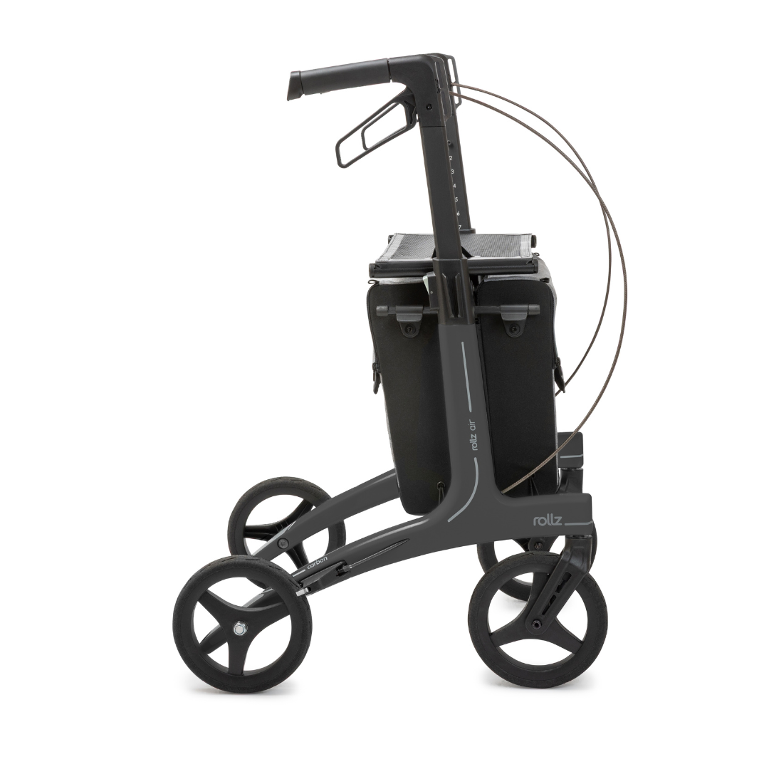 The Rollz Air Lightweight Folding Carbon Rollator weighs just 10.4 lbs and features a modern black frame, four large wheels, a storage compartment under the handles, and visible brake cables along the sleek handlebar.