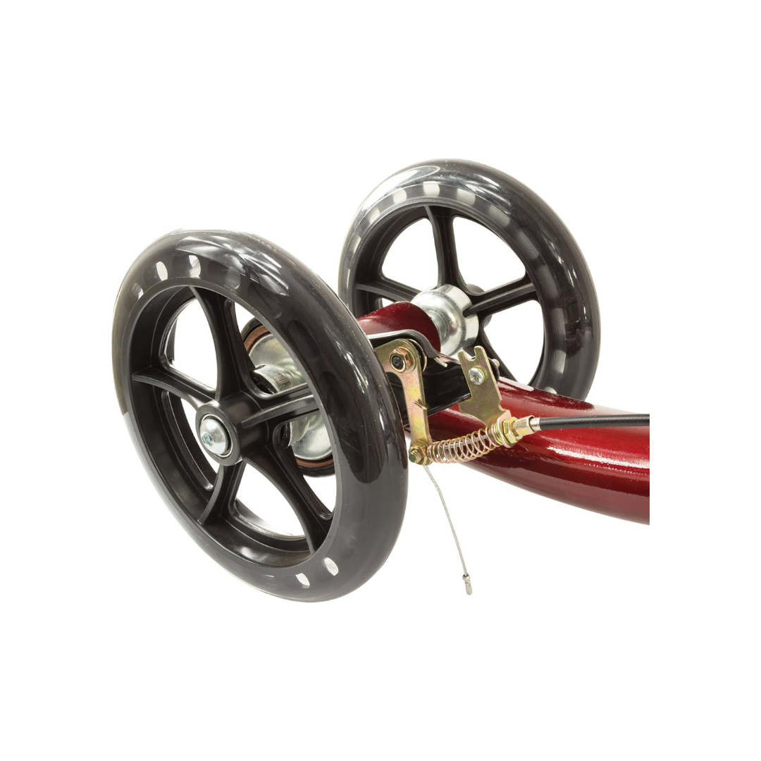 Close-up of two black plastic five-spoke wheels attached to the metallic red frame of the Roscoe Portable Lightweight Rolling Knee Walker, featuring a visible metal brake—an ideal mobility aid for recovery.