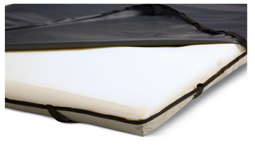 A close-up view of the Medline Standard Gel Foam Mattress Overlay, partially covered by a zippered fabric cover thats peeled back to show the white foam top layer inside.