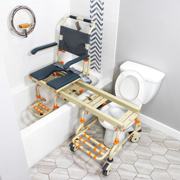 The ShowerBuddy SB2 TubBuddy Bathing System features a rolling chair with a sliding seat on rails, bridging the tub and toilet for accessible bathing while helping reduce caregiver strain during transfers.