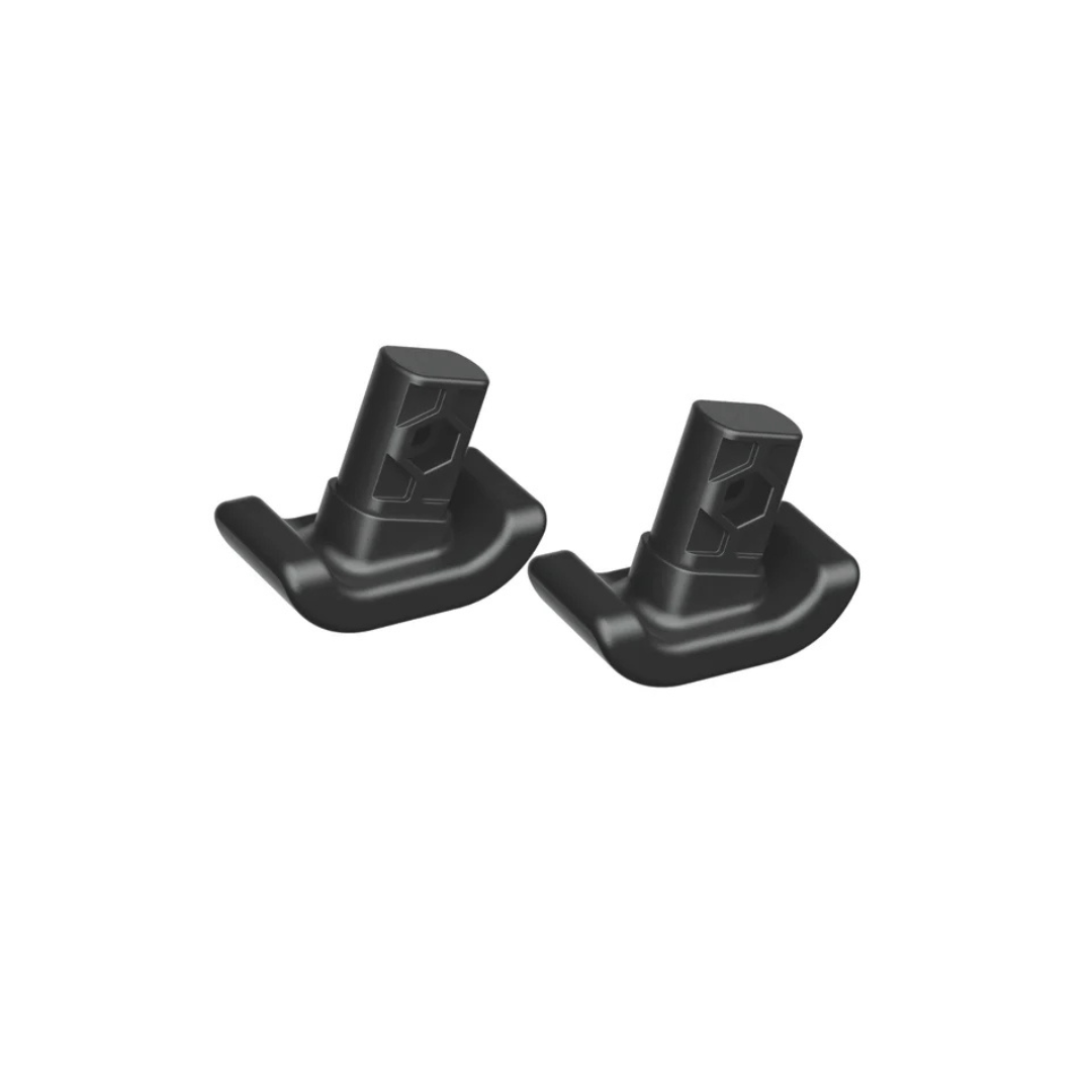 A pair of black plastic Ski Glides for Rolloy Walker with angular shapes and hexagonal holes are displayed side by side on a white background, designed to enhance indoor mobility and protect floors.