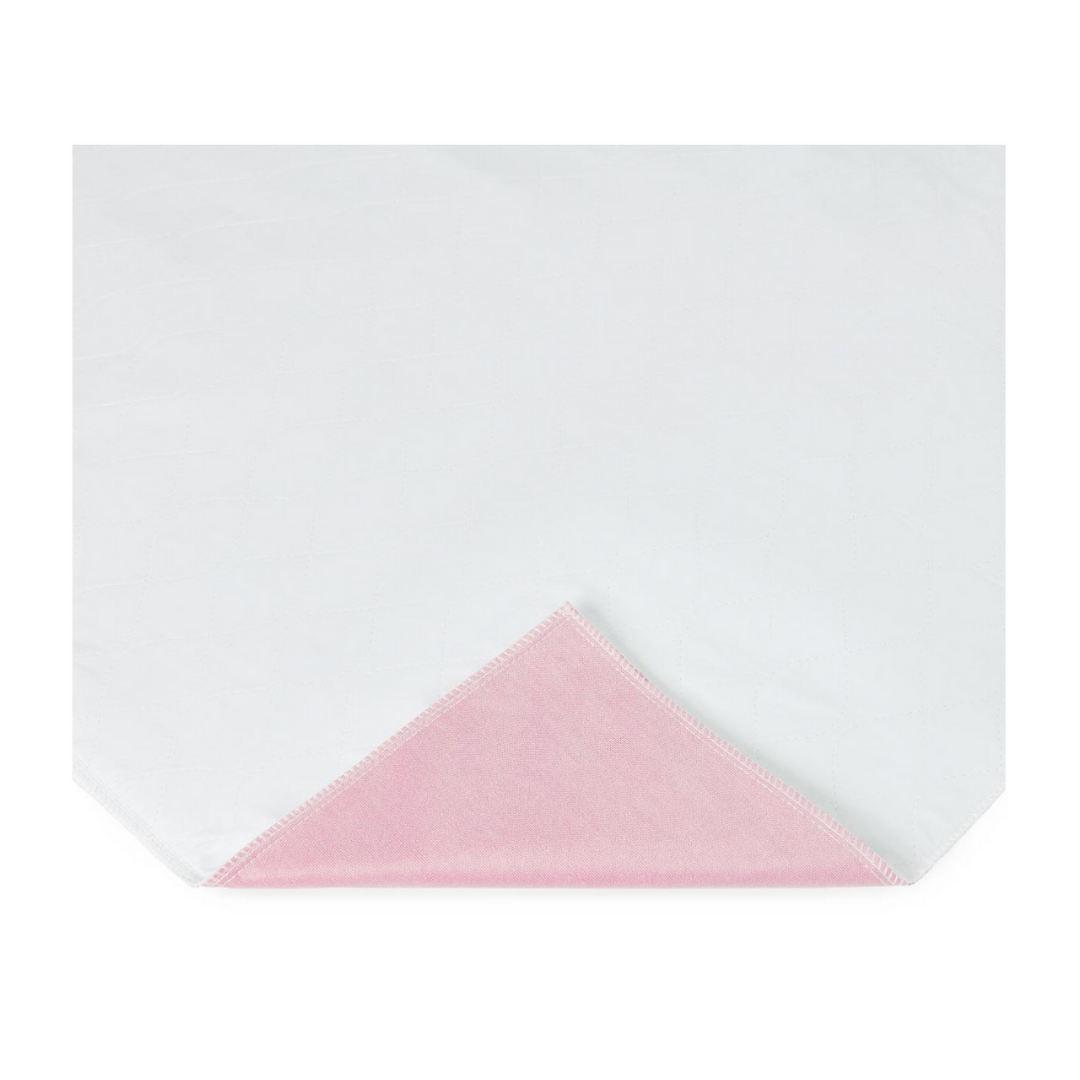 A Medline Sofnit 300 Reusable Underpad, folded to reveal its soft pink underside, combines comfort and style. Sold in a case of 24, this underpad features a practical design with a plain white top for everyday use.