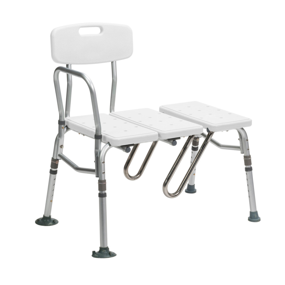 The Drive Splash Defense™ Transfer Bench with Curtain Guard Protection is a white and silver shower bench for seniors, featuring an adjustable seat, backrest with handle, armrest, drain holes, rubber-tipped legs, and enhanced bath safety.