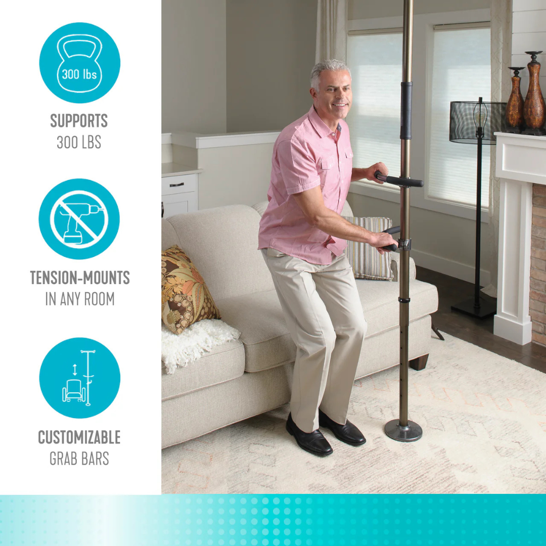 An older man uses the Stander Wonder Pole Premium—Fall Prevention Pole with a customizable grab bar by a beige sofa. Supports up to 300 lbs, tension-mounts in any room, and adds bathroom safety.