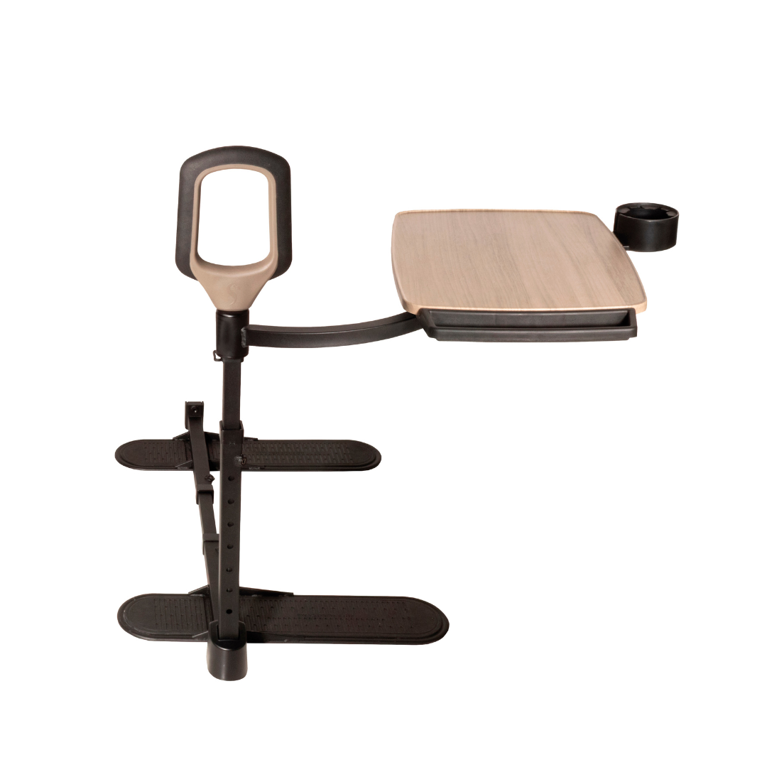 The Stander Wonder Tray Premium - XL TV Tray & Standing Aid features a cushioned stand assist handle, adjustable tray with wooden finish, cup holder, and two large flat footrests on a sturdy metal frame.
