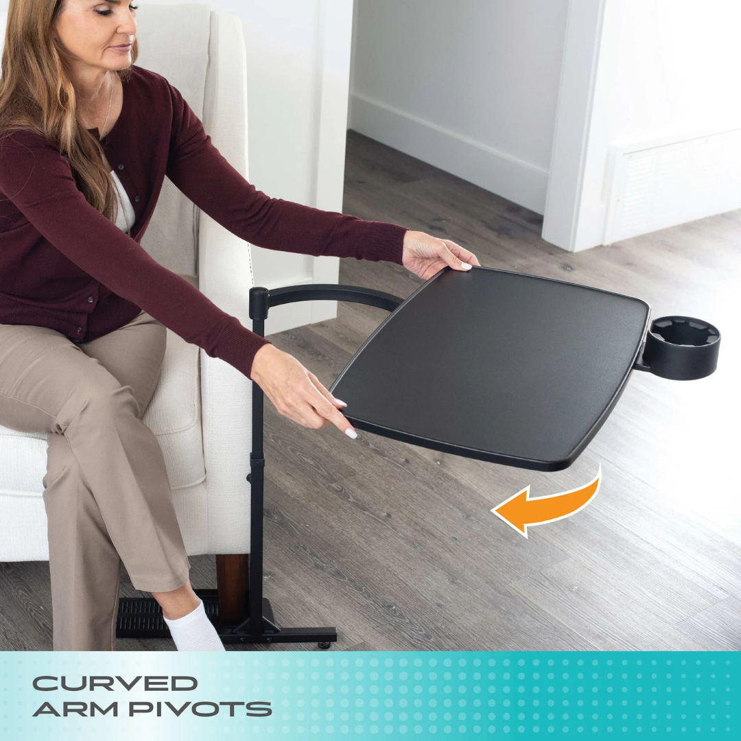 A woman pivots the Stander Wonder Tray XL - Swivel Living Room Tray Table with a cup holder while sitting on a white armchair. An orange arrow highlights its swiveling motion. Text reads Curved Arm Pivots.