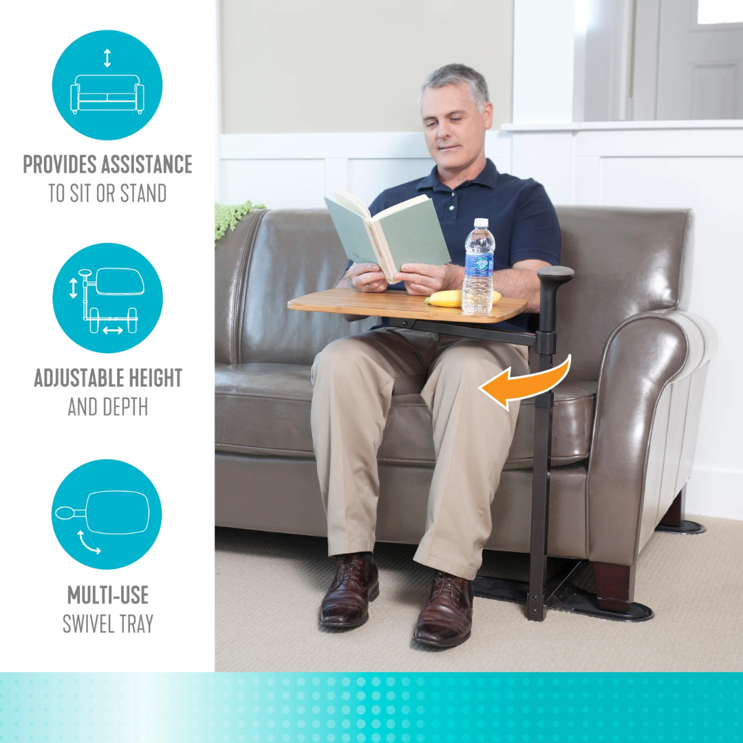 A man sits on a sofa reading with the Stander Omni Tray – TV Tray & Standing Aid in front of him, holding water and a snack. Text highlights its support handle, adjustable height/depth, and versatile multi-use design.