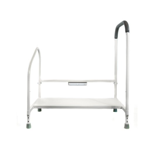 The Step2Bed XL Bedside Stepper is a white metal mobility aid with a flat platform, two support side rails, and rubber-tipped feet. A higher curved rail provides extra handhold support for added stability and fall prevention.