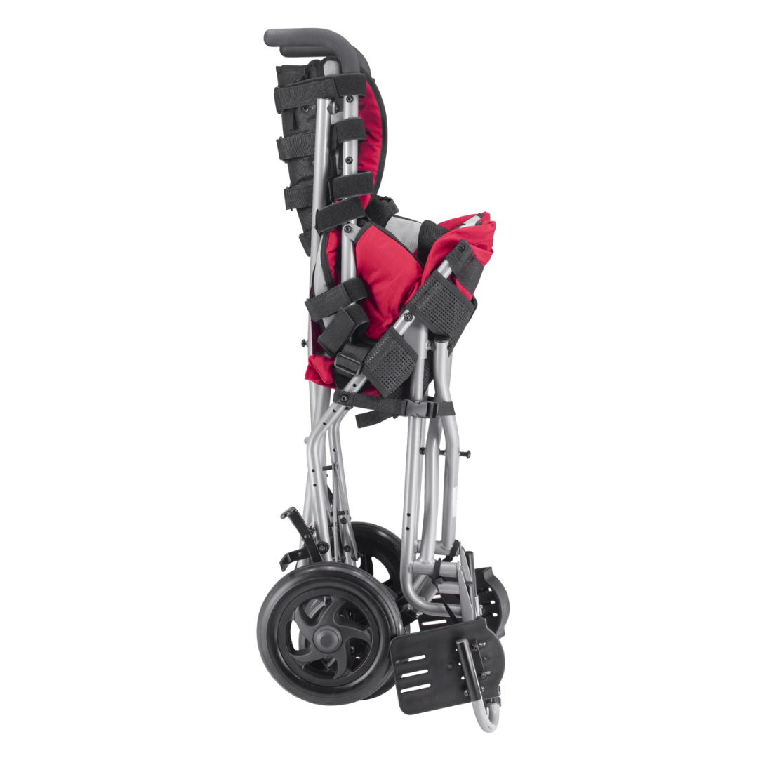 The Circle Specialty Strive Adaptive Stroller is a lightweight pediatric wheelchair with adjustable seat depth, featuring a red seat and black straps, designed to stand upright and fold compactly for easy storage or transport.