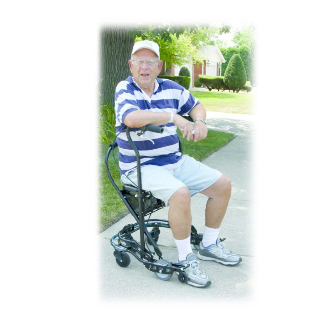 An elderly man in a striped polo, shorts, and cap sits on a U-Step Neuro Walking Stabilizer - Rolling Walker with Reverse Breaking, smiling at the camera on a sunny sidewalk with trees and a house in the background.