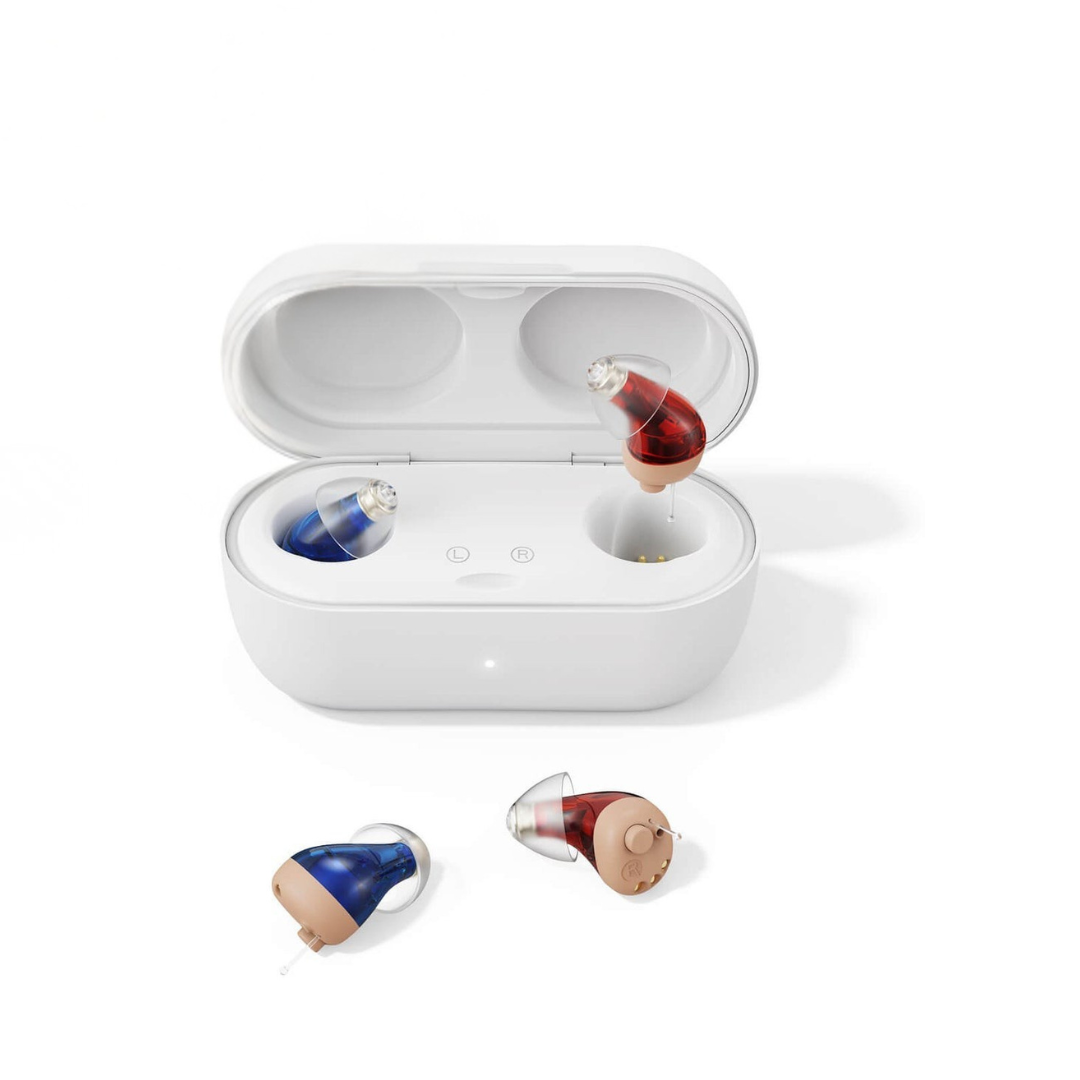 A white case holds one red and one blue Vivtone SuperMini Hearing Aid, shown open. Two matching next-generation Vivtone SuperMini Hearing Aids are displayed on a white surface beside the case.