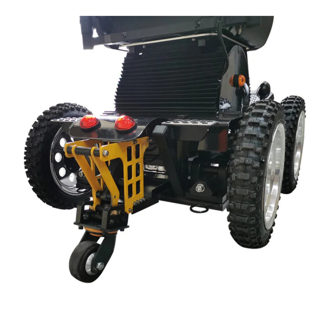 Close-up of the rear wheels and suspension on the Wheelchair88 All-Terrain Stair Climbing 4x4 Recreational Electric Vehicle, featuring rugged tires, caster wheel, red lights, mechanical components, and advanced 4-wheel drive for off-road use.