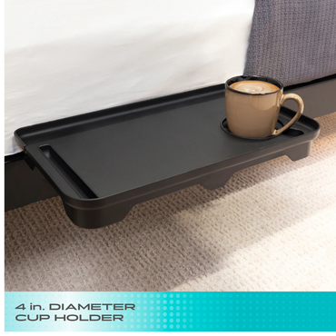 The Stander Wonder Bedside Shelf Tray is a black shelf that attaches to your bed, featuring a 4" cup holder for your drink—an efficient, space-saving way to keep essentials like coffee close at hand.