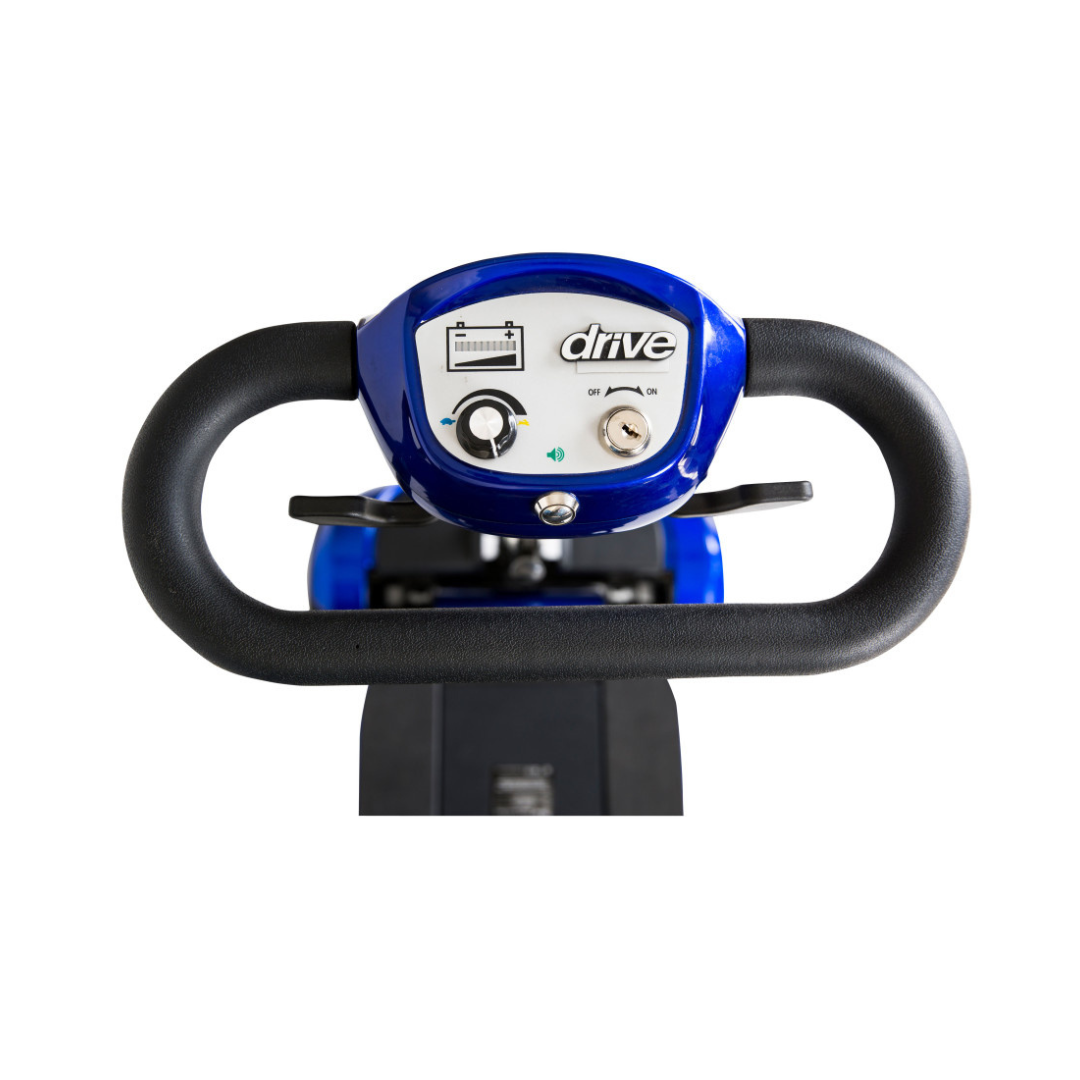 Close-up of the Drive ZooMe Auto-Flex Folding Travel Scooter control panel featuring a battery indicator, speed dial, and key slot, set within black handlebars against a white background.