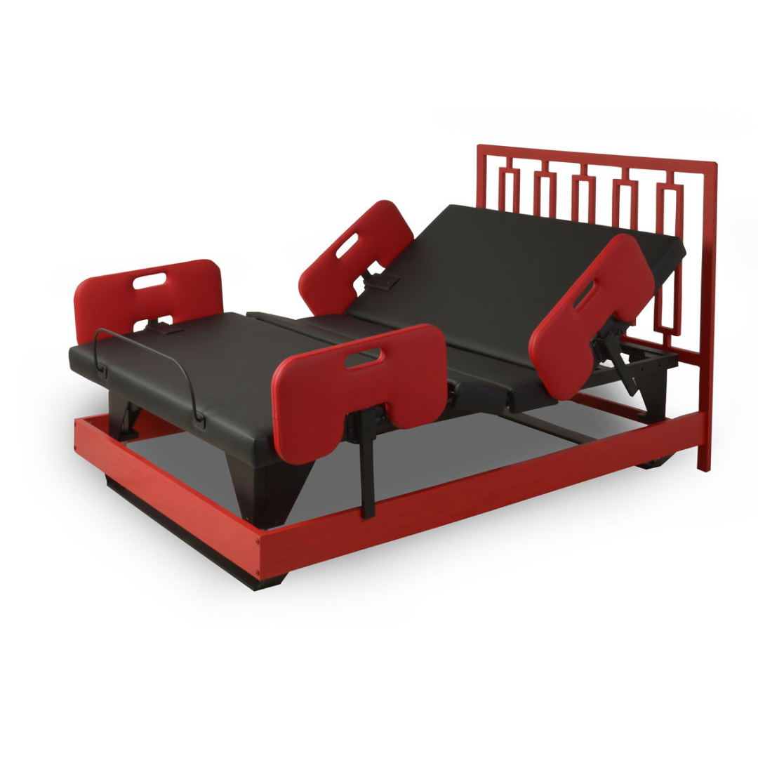 The Assured Comfort® Signature Series Hi-Low Adjustable Bed features a red frame, black mattress, movable head and foot sections, red safety rails, and a slatted headboard for modern comfort and safety.