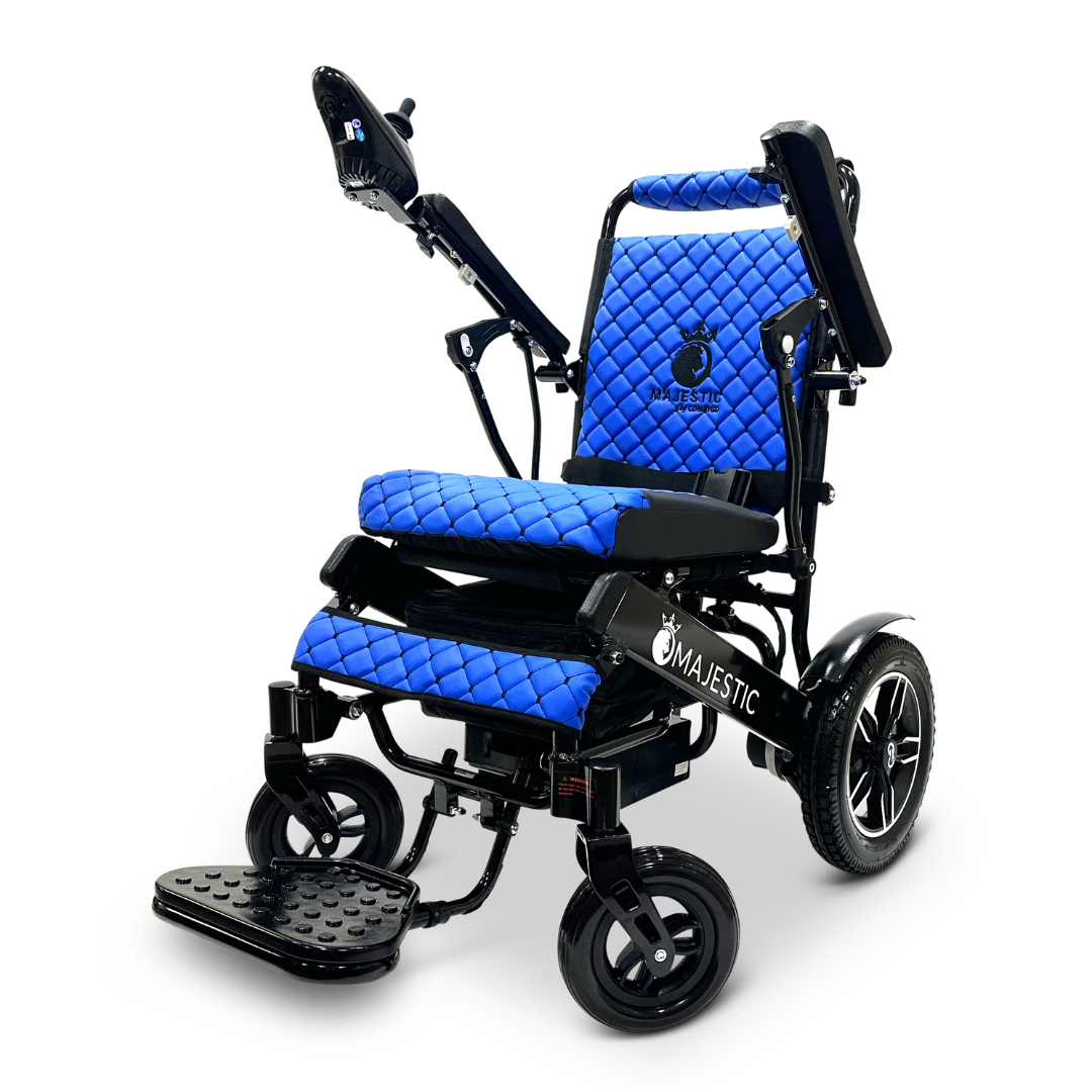 The ComfyGo MAJESTIC IQ-8000 Remote Controlled Lightweight Electric Wheelchair is perfect for travel, featuring a vibrant blue quilted seat and backrest. Equipped with a joystick control on the right armrest, black wheels, a sturdy frame, and a foldable footrest, it offers enhanced mobility and comfort in a lightweight design.